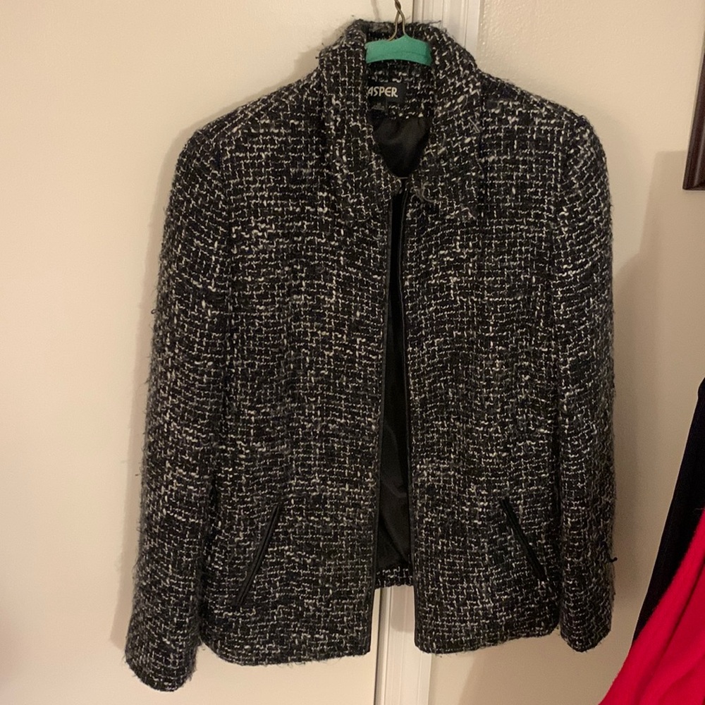 Black and white tweed jacket with leather trim and zipper closure